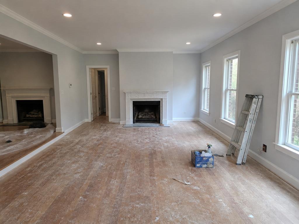 Living room during post-construction cleanup with dust and debris
